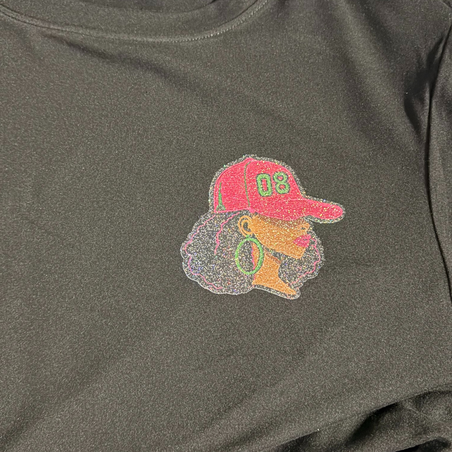 Black Long Sleeve Shirt with Female with "08" Baseball Cap in Pink and Green