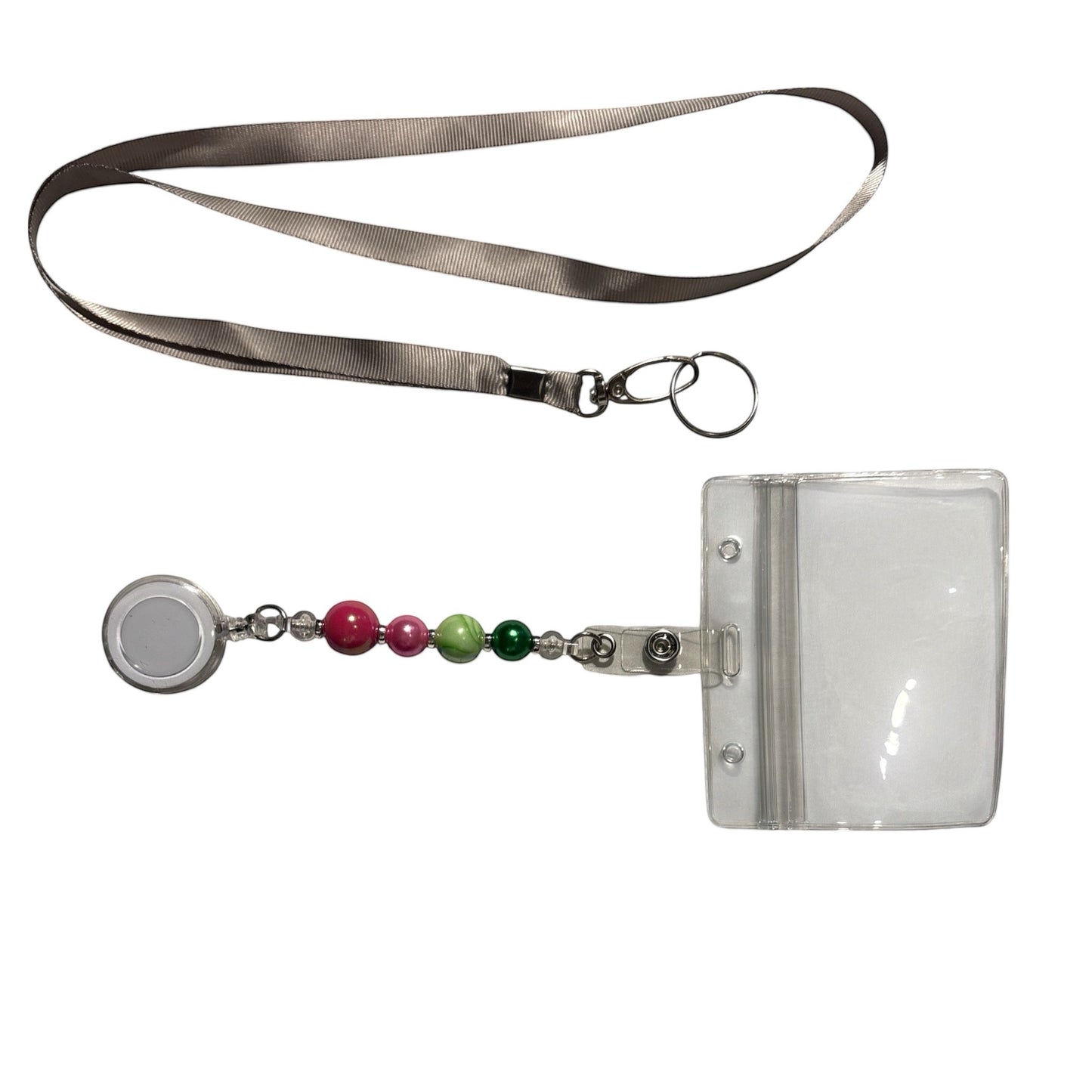 House of Lux Gifts retractable ID badge lanyard with pink and green beads and a clear plastic card holder