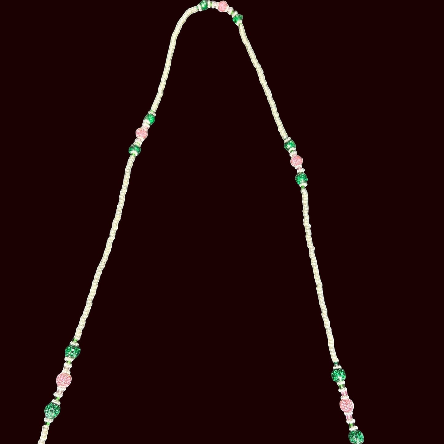 House of Lux Gifts beaded shoulder strap with alternating pink and green crystal accents on a white cord