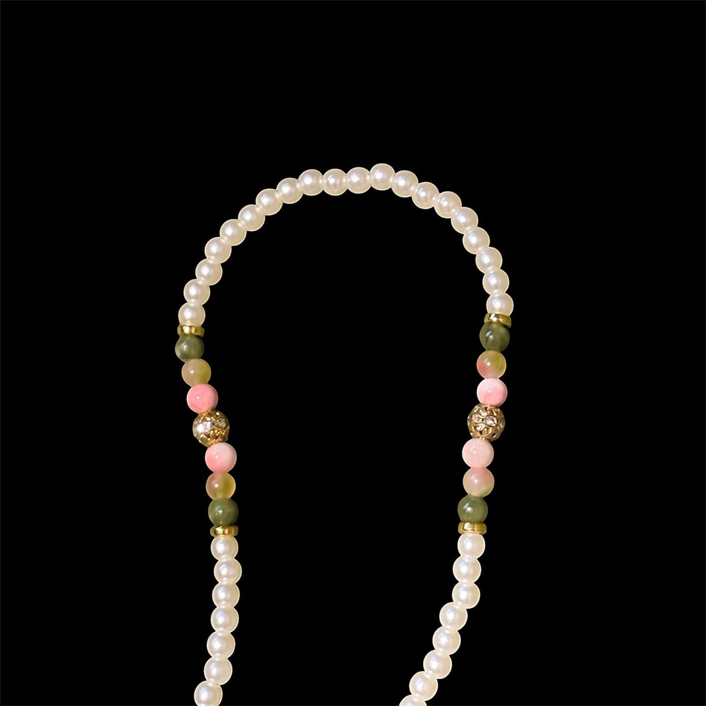 House of Lux Gifts beaded shoulder strap with green jade, pink rose quartz, and white faux pearls on a black background