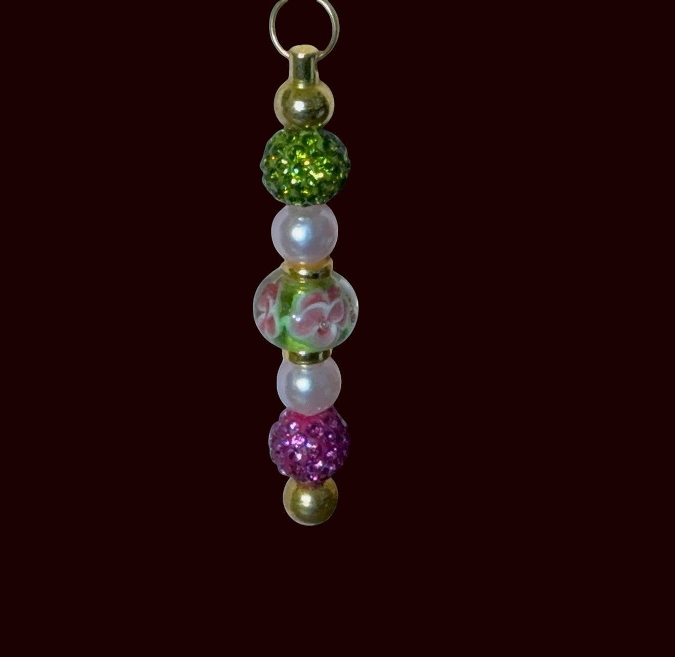 House of Lux Gifts decorative beaded zipper pull featuring green, pink, and pearl acrylic beads with gold accents.