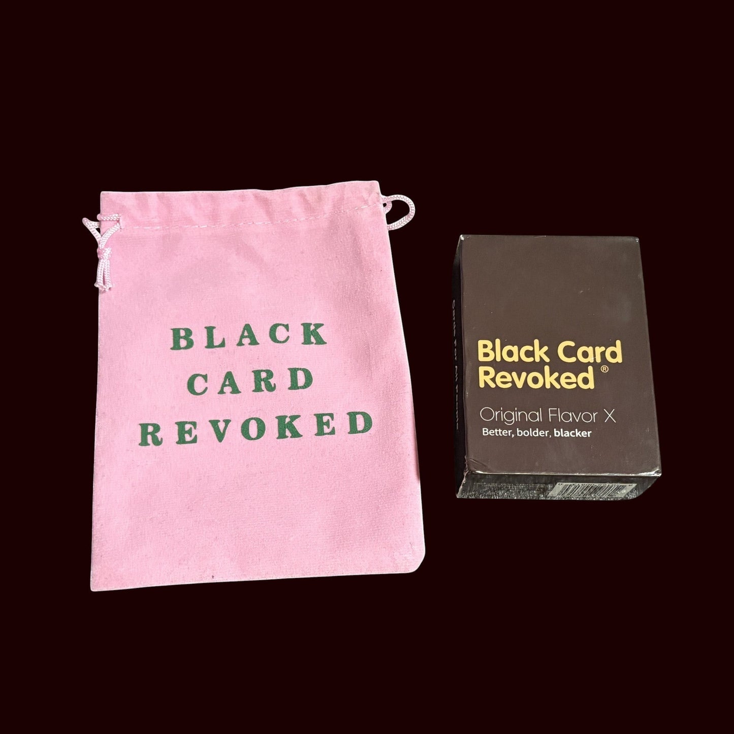 House of Lux Gifts Black Card Revoked game set with a pink velvet drawstring bag and card deck box.