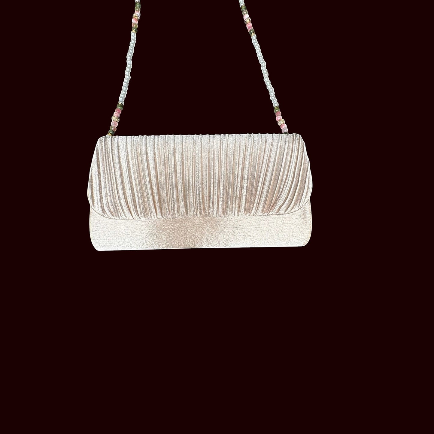 House of Lux Gifts cream pleated evening clutch with a beaded shoulder strap featuring pink and green gemstone accents.