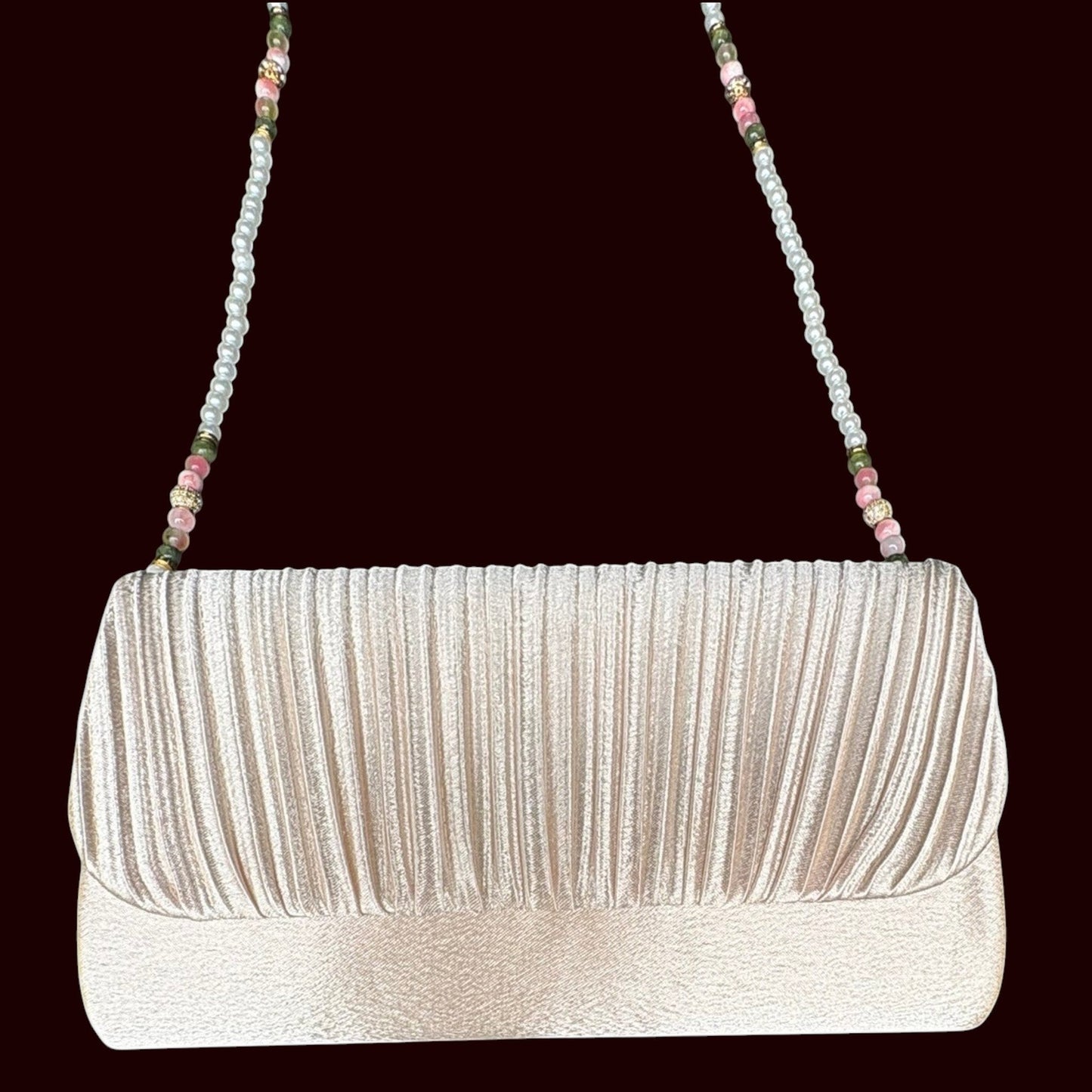 House of Lux Gifts cream pleated evening clutch with a beaded shoulder strap featuring pink rose quartz and green jade.