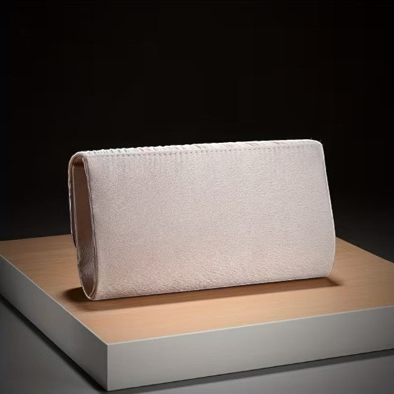 House of Lux Gifts cream evening clutch with a sleek satin finish displayed on a wooden platform.