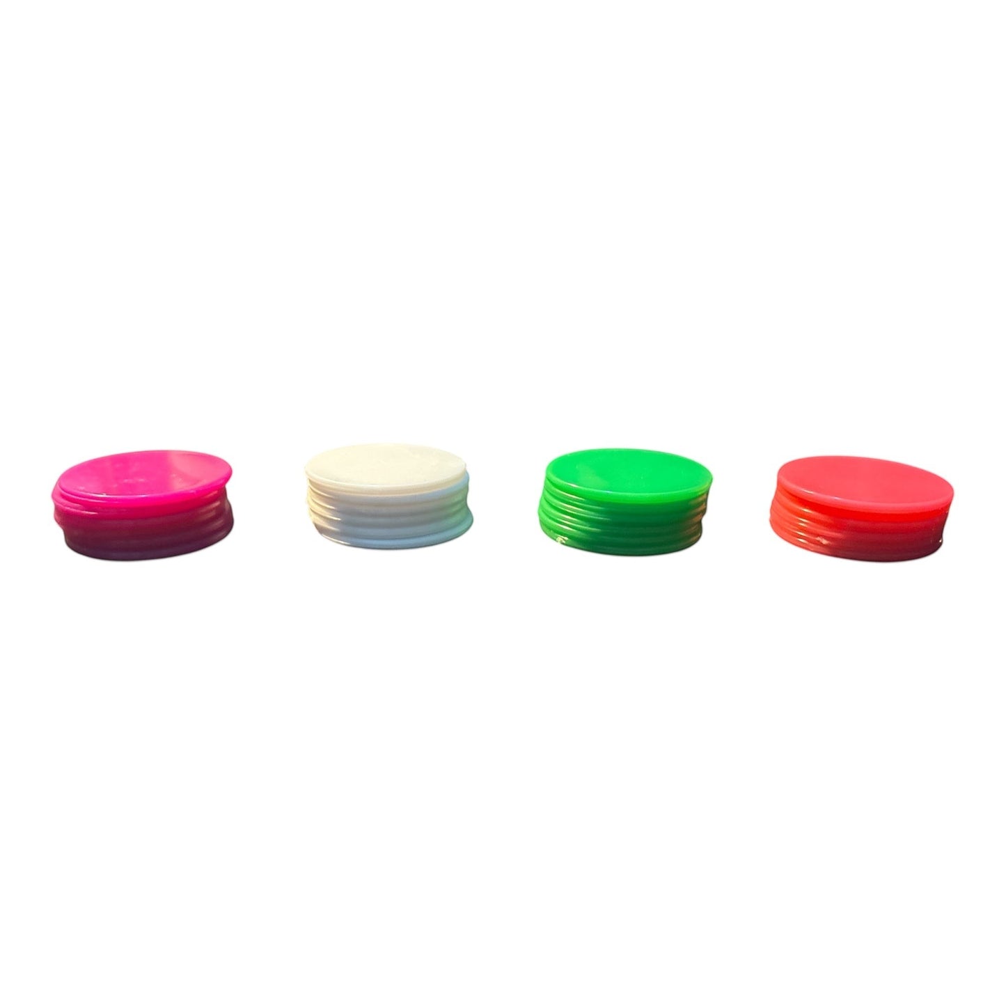 House of Lux Gifts game night chips in stacks of pink, white, green, and magenta plastic for board games