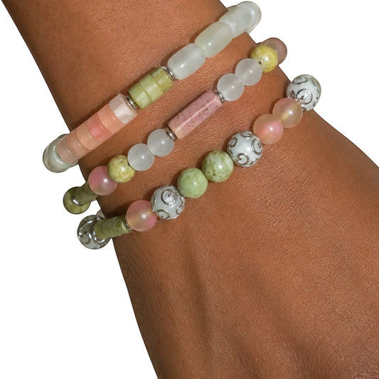 House of Lux Gifts AKA  handcrafted gemstone stretch bracelets in mint, olive, and blush pink with metallic spacers.