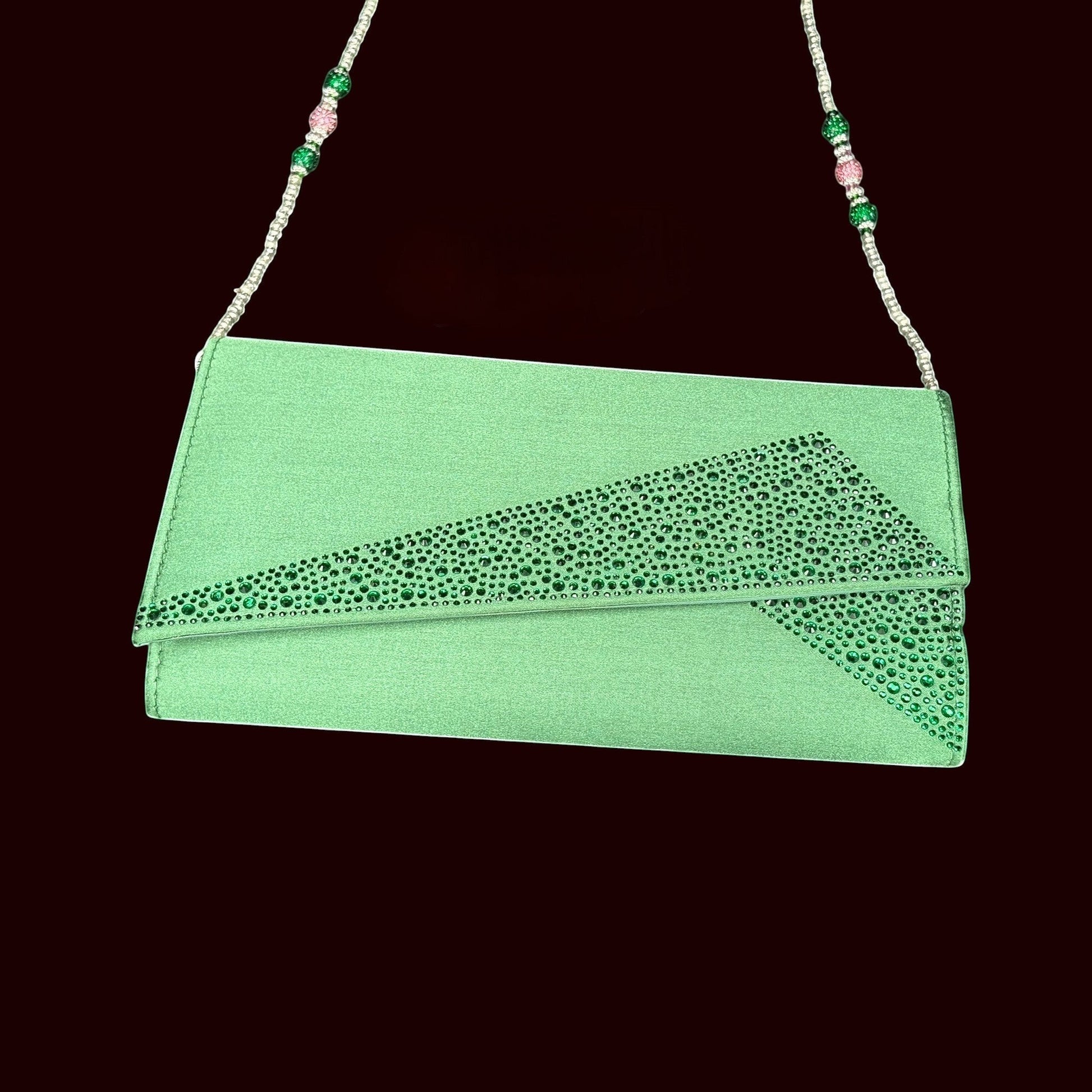 House of Lux Gifts green crystal evening clutch with rhinestone embellishments and a beaded shoulder strap.