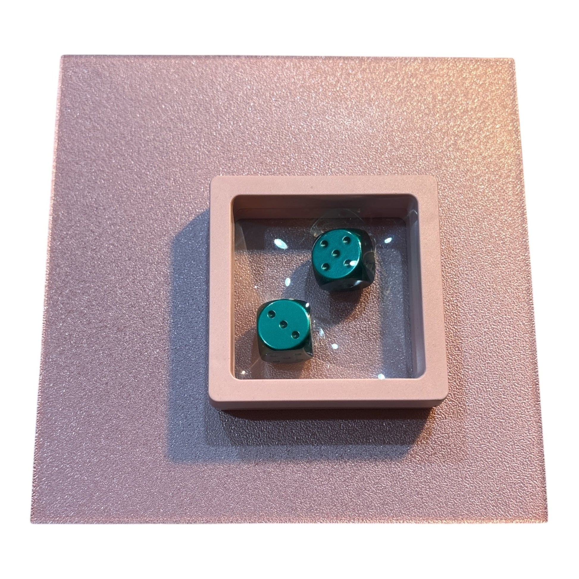 House of Lux Gifts luxury game night box featuring two metallic green dice inside a pink display case.