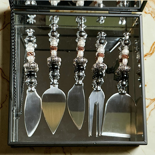 House of Lux Gifts mirrored charcuterie gift box with five stainless steel serving tools featuring beaded handles.