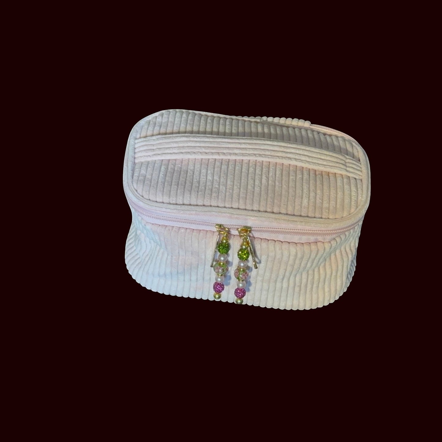 House of Lux Gifts blush pink ribbed corduroy cosmetic bag with gold zippers and decorative beaded pulls
