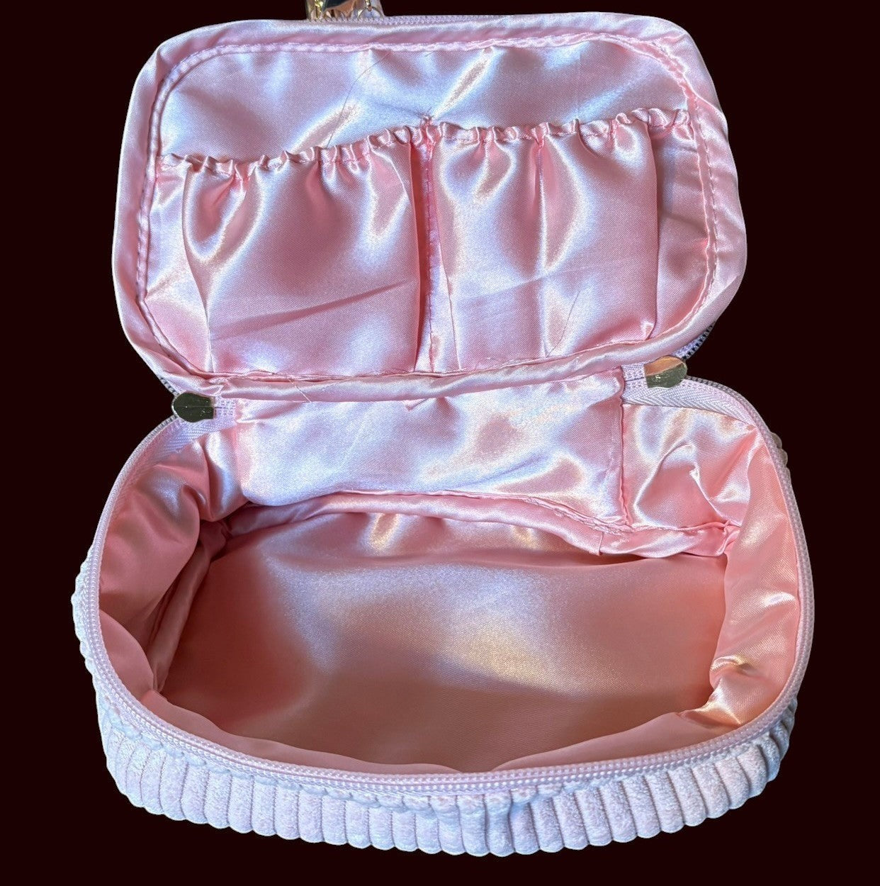 House of Lux Gifts blush pink corduroy cosmetic bag with open lid, satin interior lining, and elastic pockets.