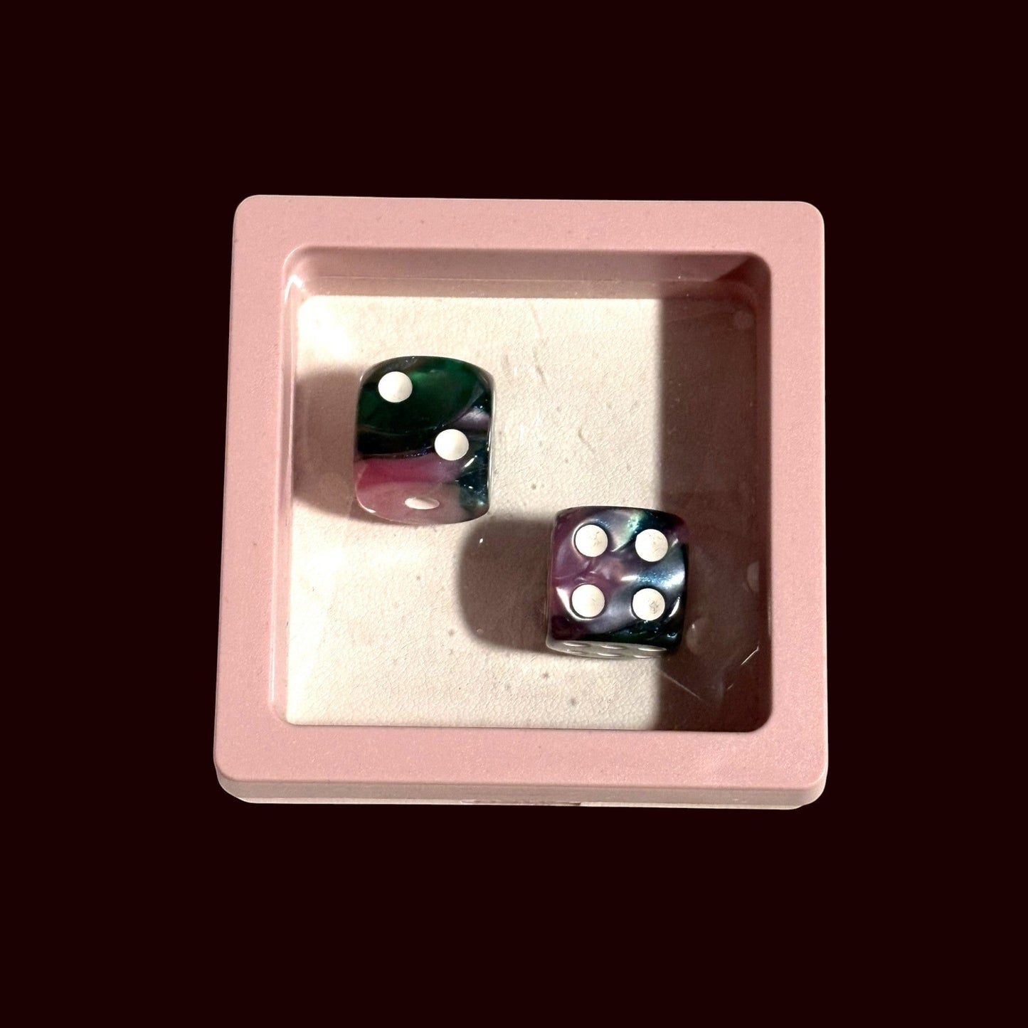 House of Lux Gifts pink and green marbled dice set inside a small square pink display box for game night