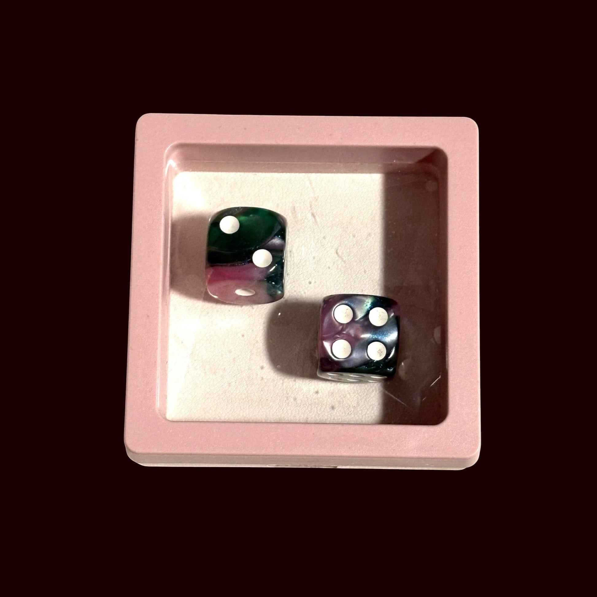 House of Lux Gifts pink and green marbled dice set inside a small square pink display box for game night