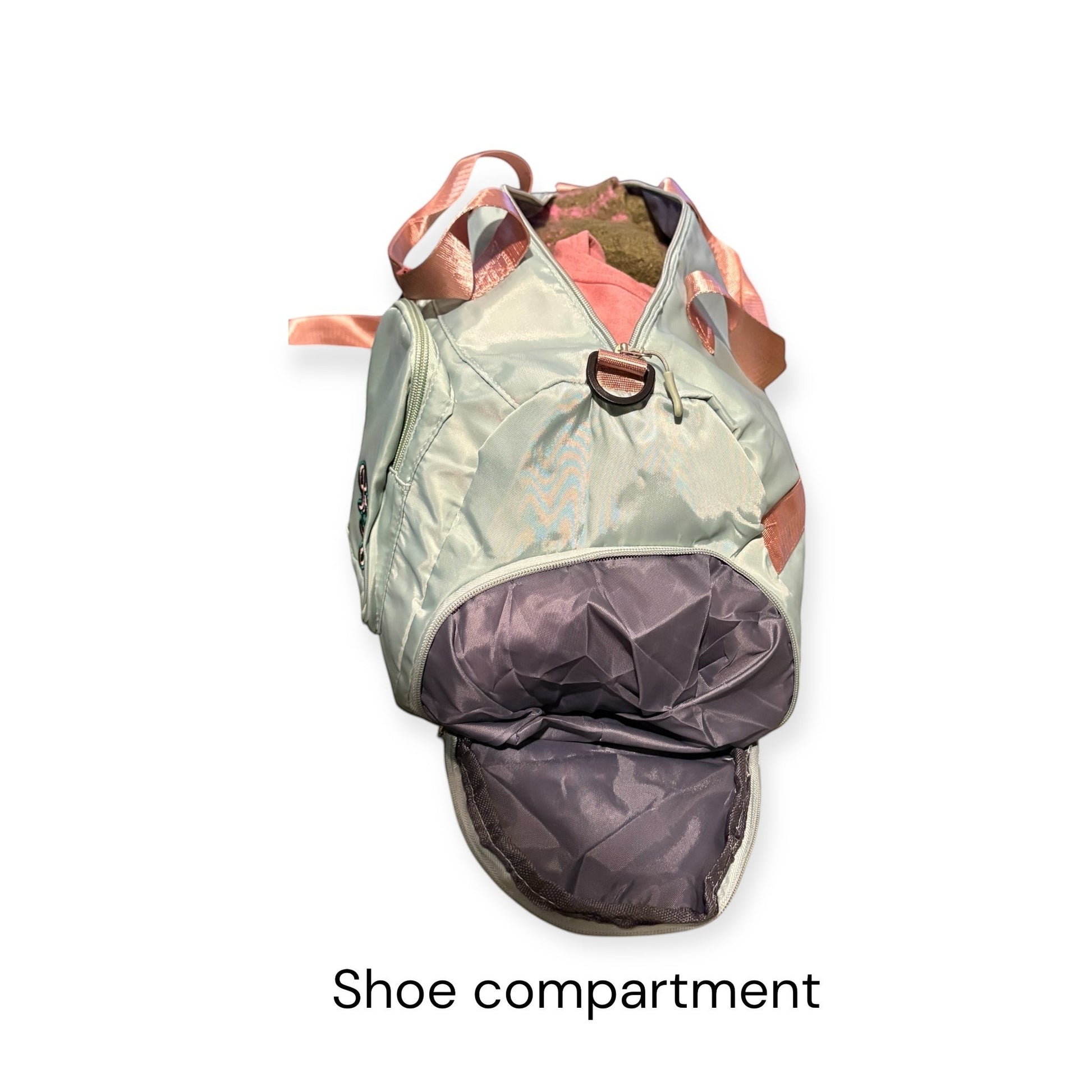 House of Lux Gifts pink and green travel duffel bag showing the side shoe compartment and pink carry straps.