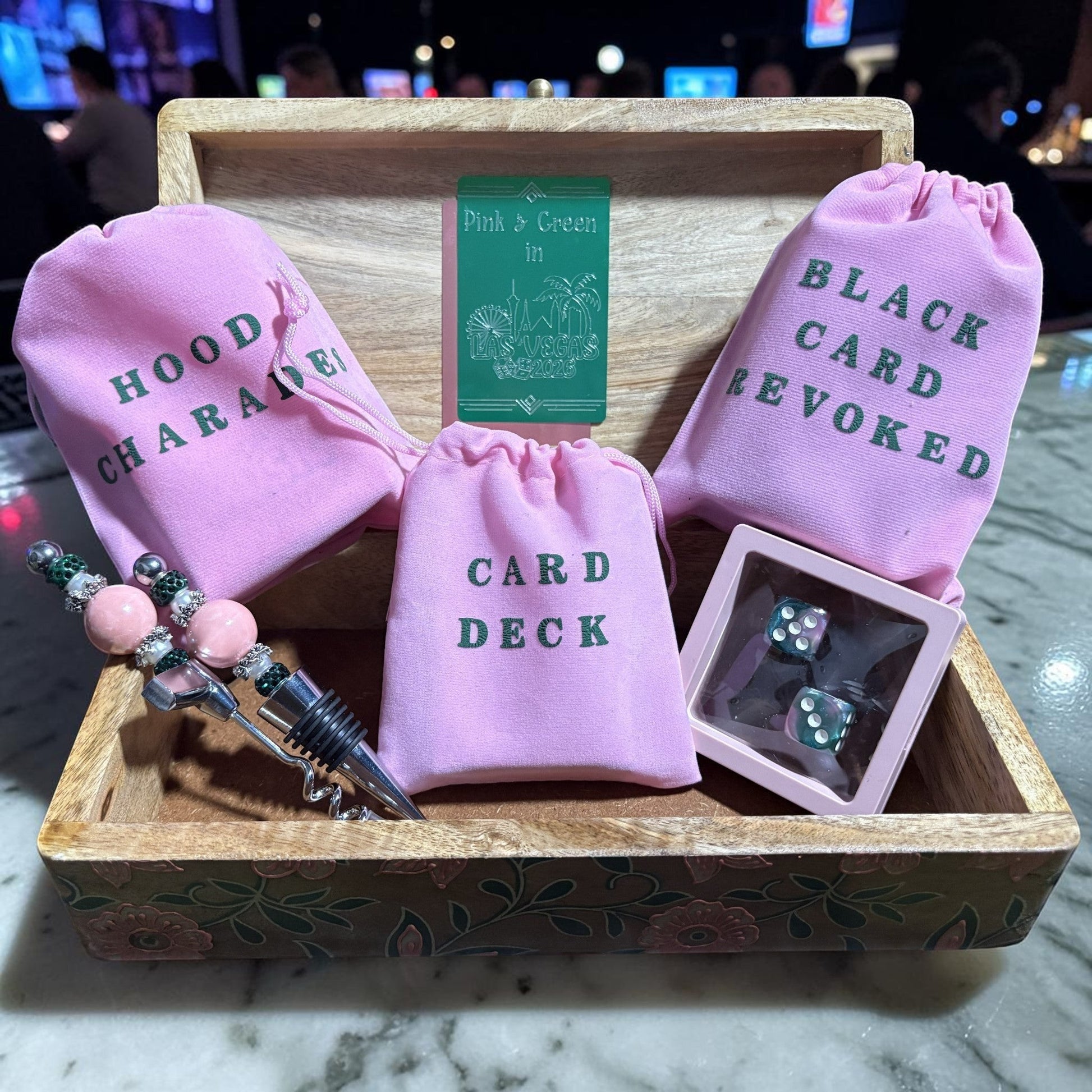 House of Lux Gifts pink and green luxury game night set in a wooden keepsake box with velvet game pouches and dice.