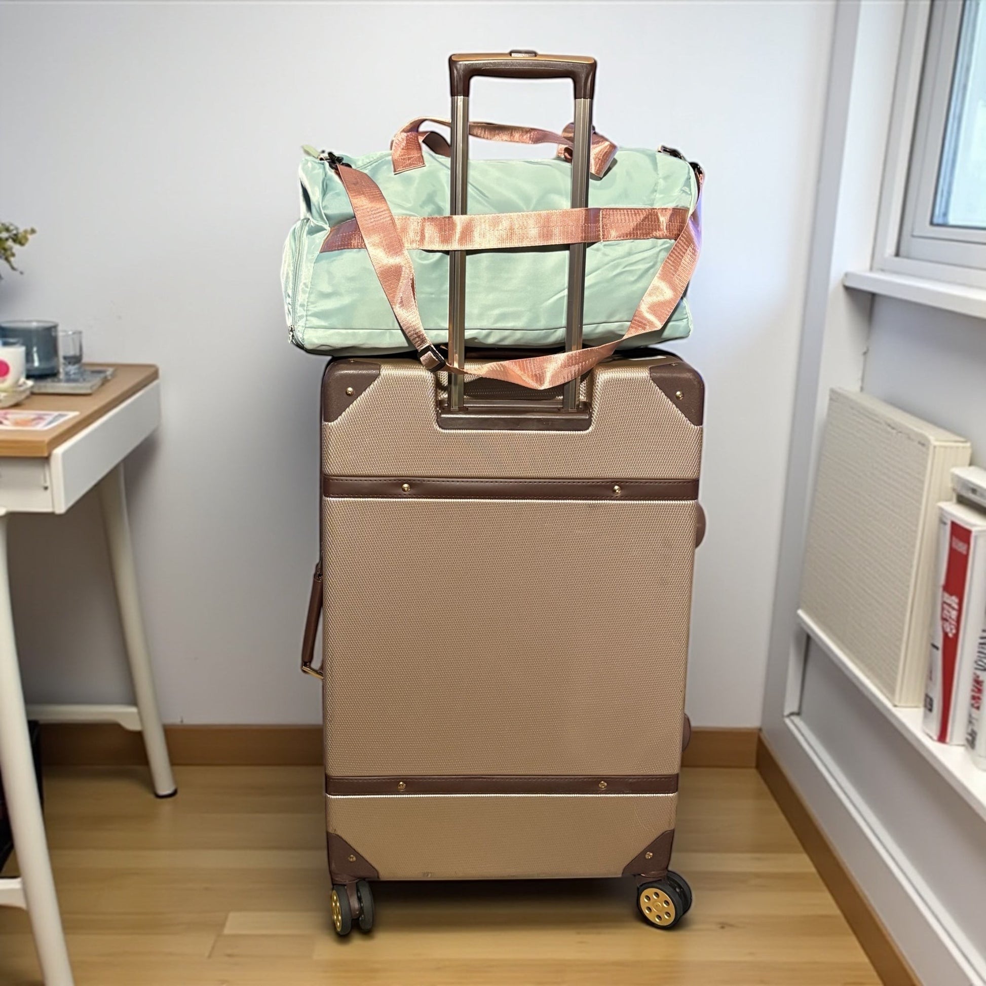 House of Lux Gifts pink and green Pretty Girl travel duffel bag attached to a rolling suitcase handle.
